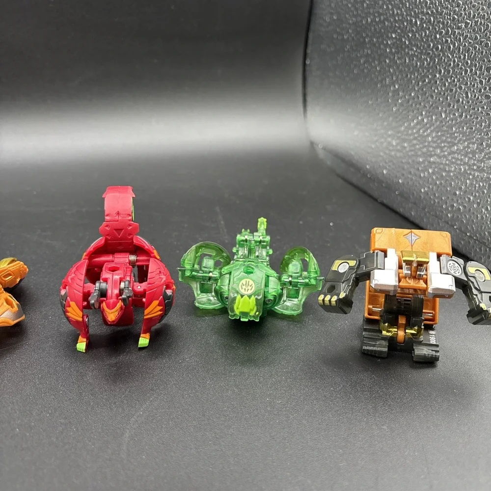Lot Of 9 Bakugan Figures And 23 Bakugan Cards/Metal Card